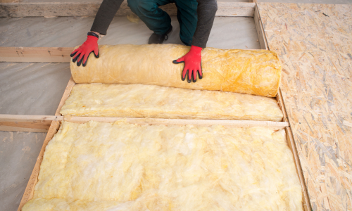 Man installing insulation